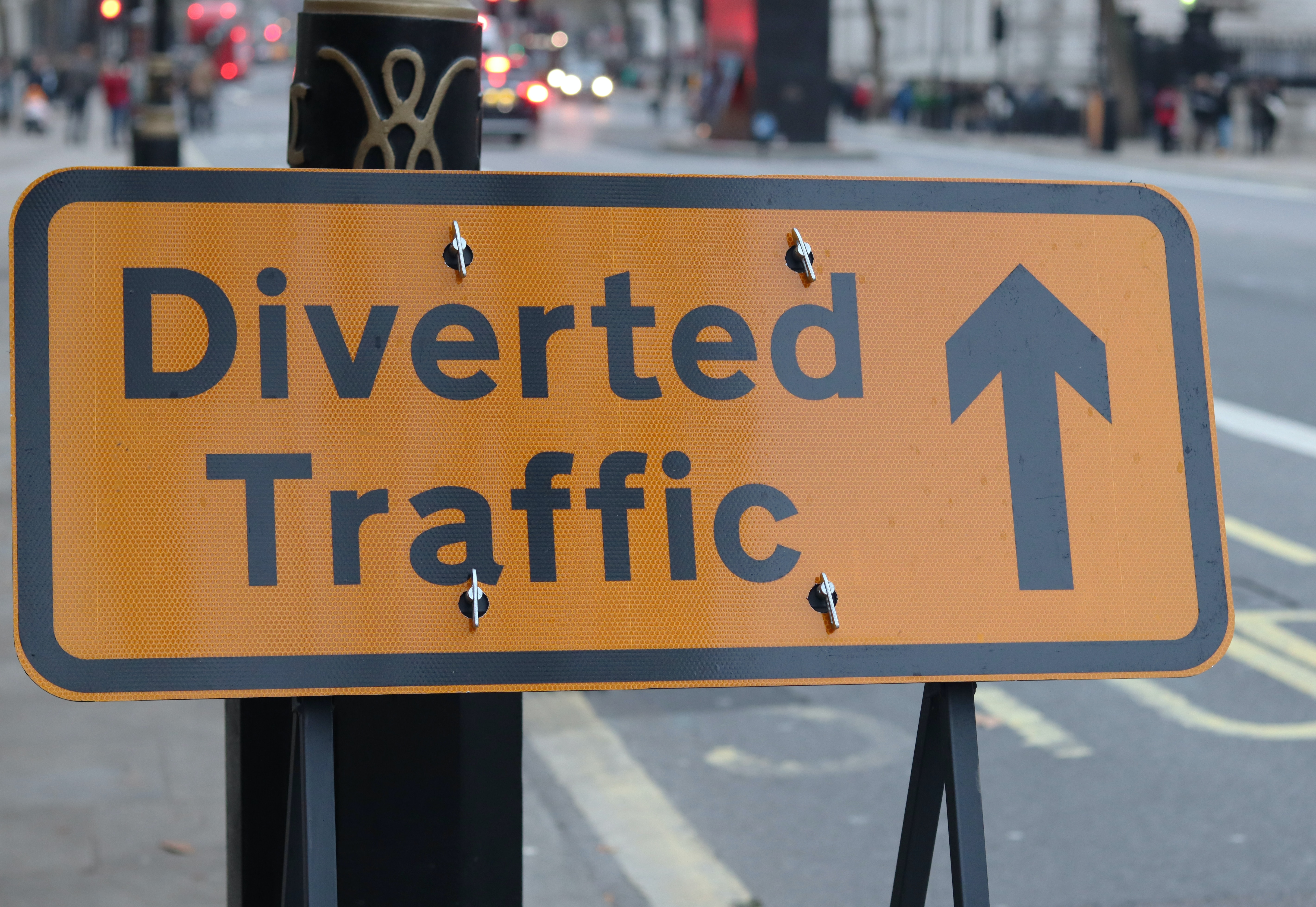 Close up of a 'diverted traffic' road sign on a London street.