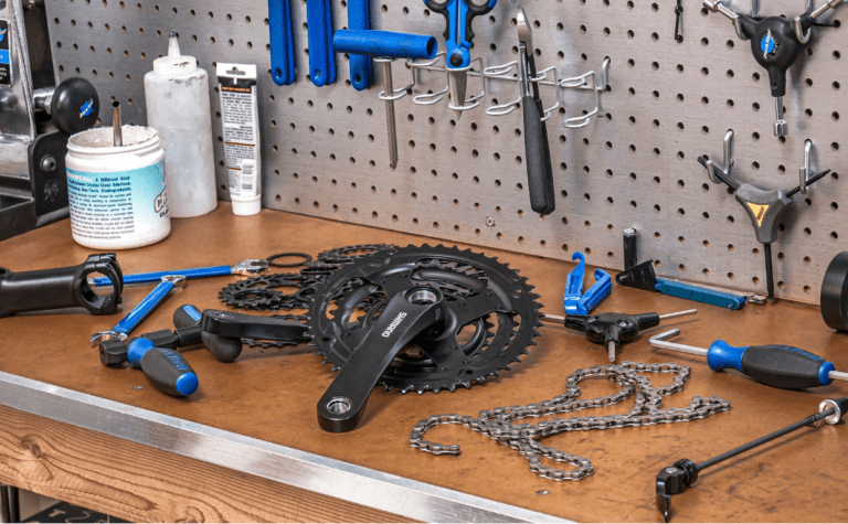 Bike parts and tools on a work bench