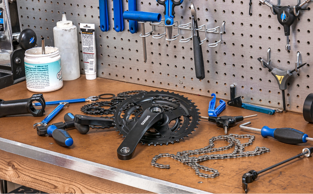 Bike parts and tools on a work bench